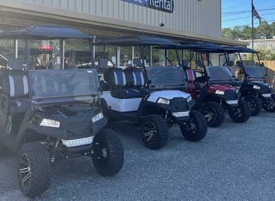 Golf Carts out front of a store | Golf Cart World